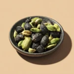IZ VOZ EXIM Group_of_cardamom_pods_green__black_on_small_plat_8e868e3e-496c-4c6d-92c2-f8e3932bc2c3_0Image